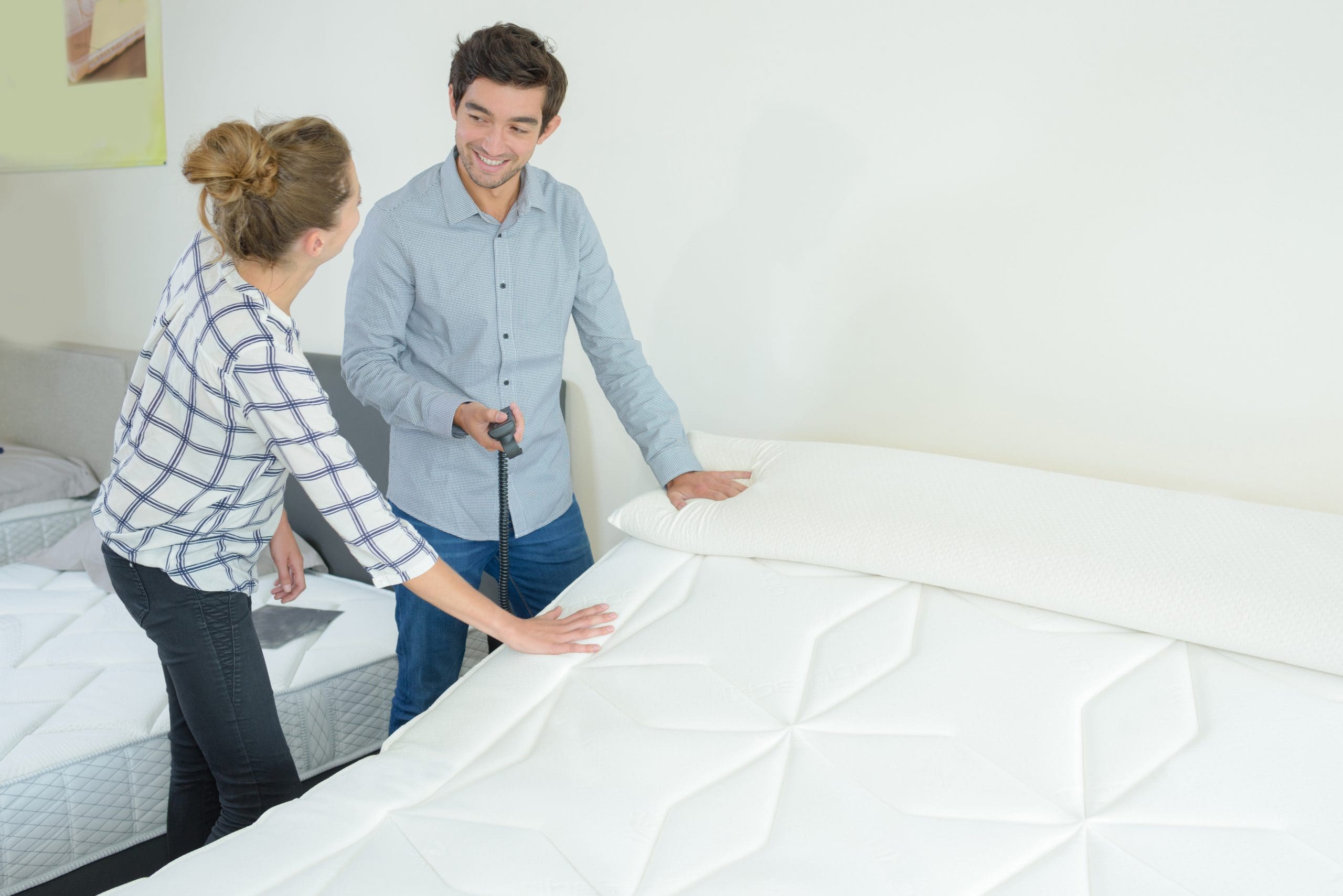 People in a mattress showroom